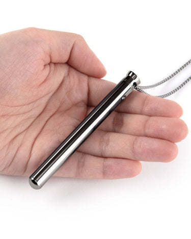 a person is holding a metal object in their hand